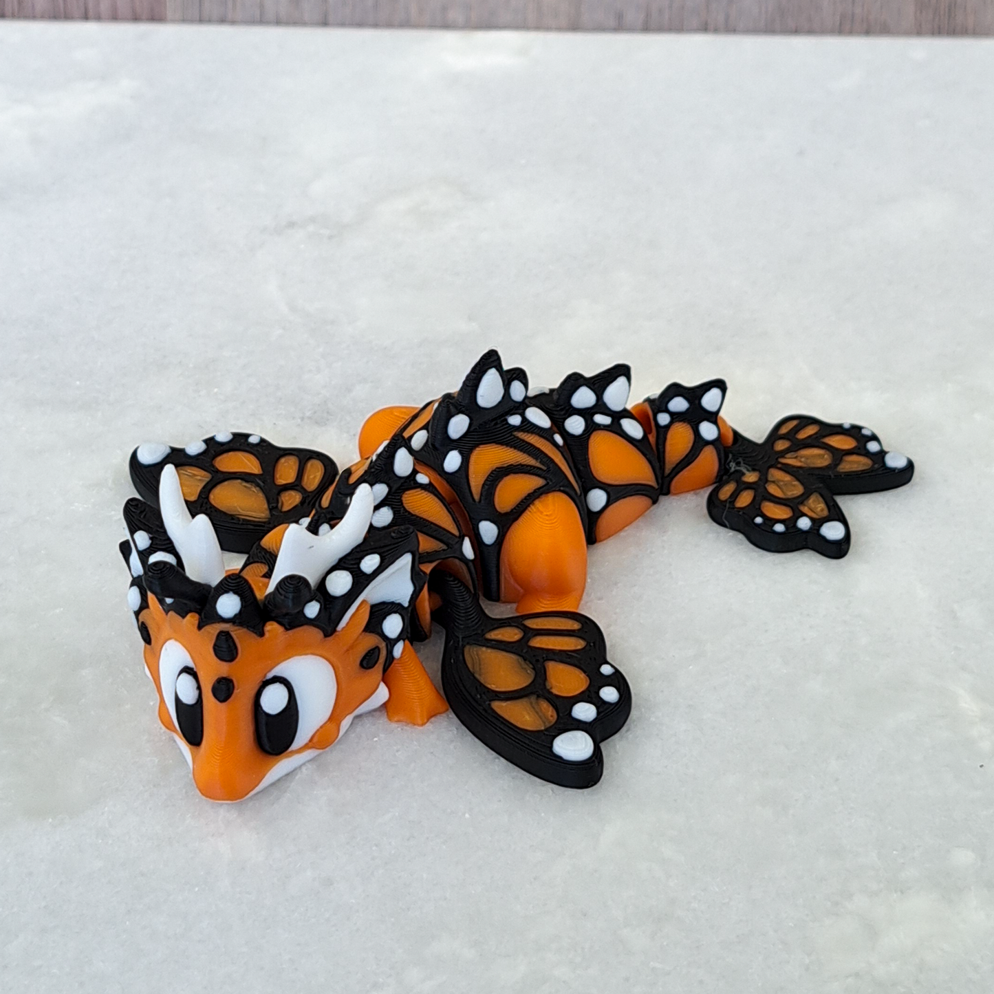 Œuf-Dragon Papillon – Une Métamorphose Magique à Collectionner